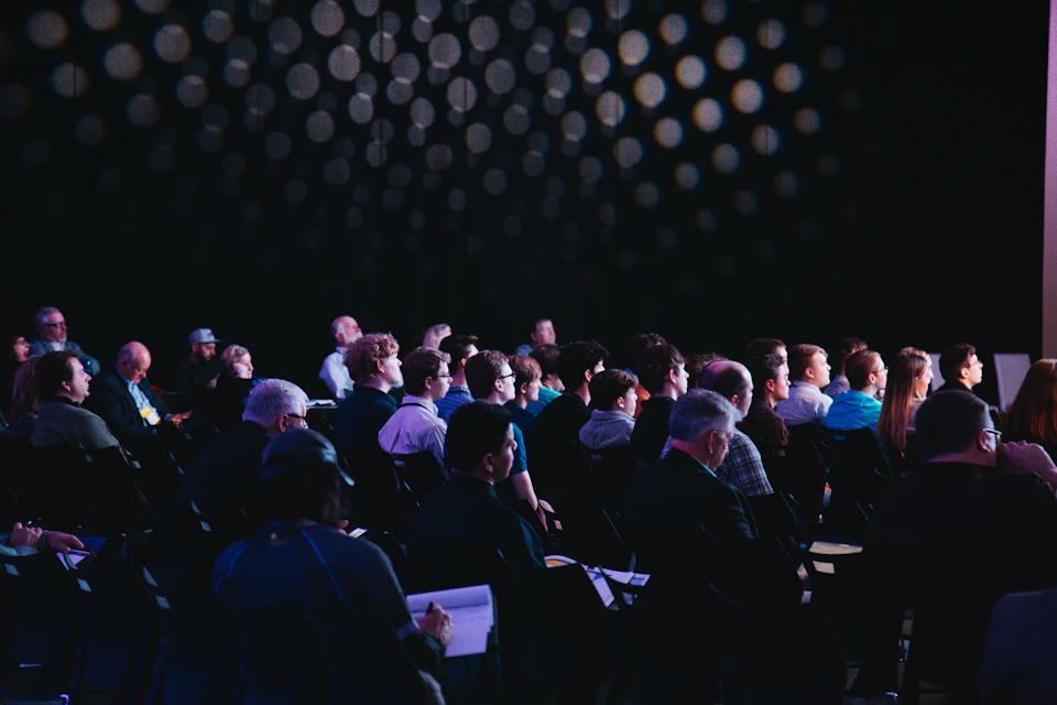 Audience attending a corporate conference session