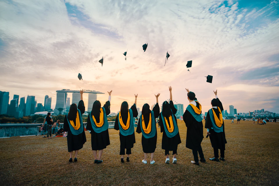 Graduating students celebrating at a school ceremony